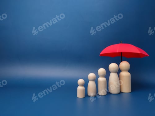 Preview: Small wooden toy figurines against the miniature red umbrella against a blue wall - copy space