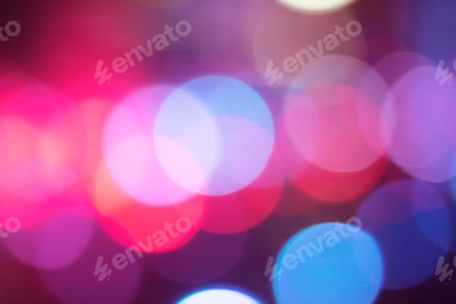 Preview: Defocused colored lights and sparkles. Festive background concept. Copy space