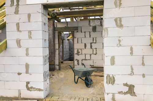 Preview: Interior of a private house with aerated concrete brick walls and wooden frame for future roof
