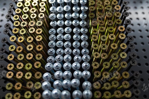 Preview: golden and silver strong nails close-up in a hardware store