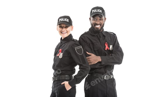 Preview: confident police officers with aids awareness red ribbons looking at camera isolated on white
