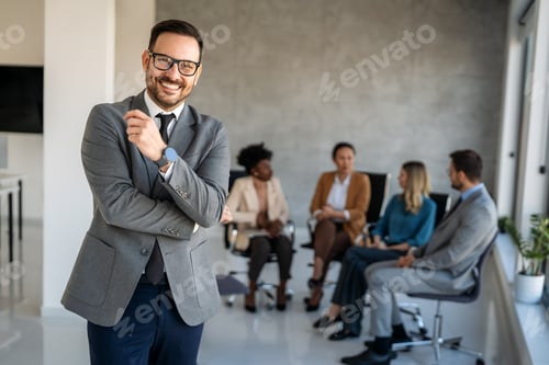 Preview: Professional in office environment, highlighting teamwork, collaboration, leadership, and innovation