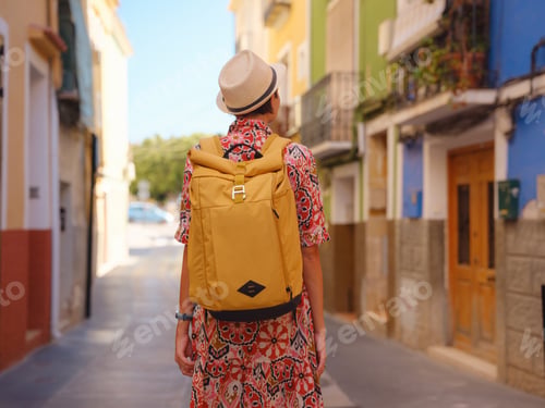 Preview: Woman strolls through colorful streets of Spanish coastal town