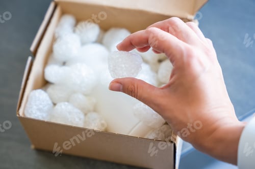 Preview: Eco packaging of parcels and white biodegradable filler. Box is filled with a filler safety for