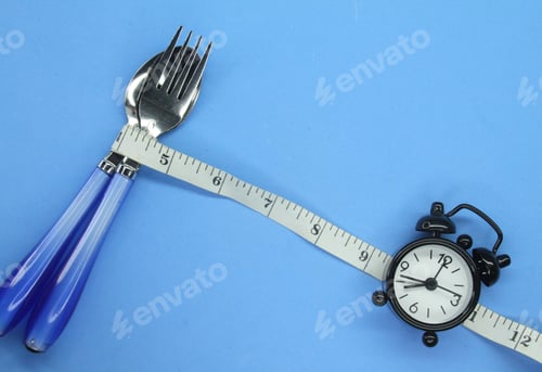 Preview: spoons and forks wrapped around measuring and clockwork.