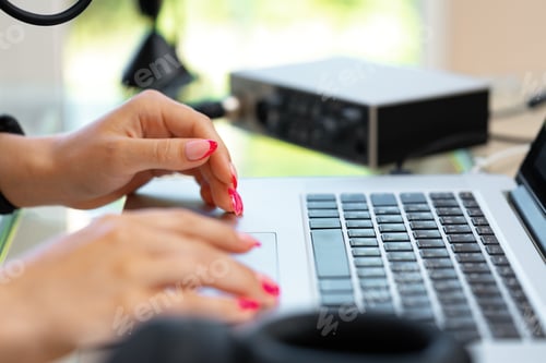 Preview: Close up of woman hands typing on laptop keyboard at the office