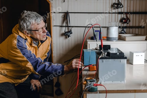 Preview: Mechanic doing service on electric car battery