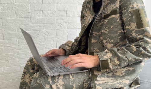 Preview: Soldier with laptop on white background