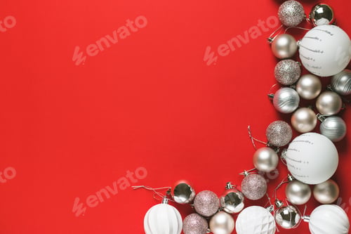 Preview: White christmas balls decoration on red background. Flat lay. Holiday concept.