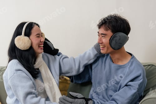 Preview: Winter cold home people family inside love couple happy enjoying cozy warmth together wearing