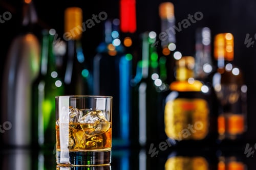 Preview: Whiskey on the rocks on a bar table
