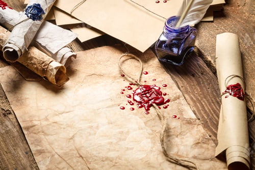 Preview: Old scrolls, sealing wax and blu ink on wooden table