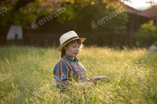 Preview: Cute little girl having fun in a dandelion field