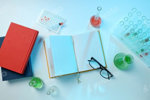 Preview: Books with chemical test tubes on the table