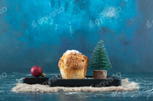 Preview: Delicious muffin with Christmas small tree and ball
