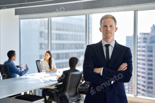 Preview: Confident young business man team manager standing in office. Portrait