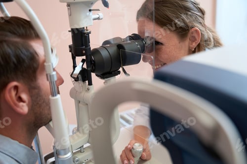 Preview: Elegant female looking for problems and caring for eyes in ophthalmology center