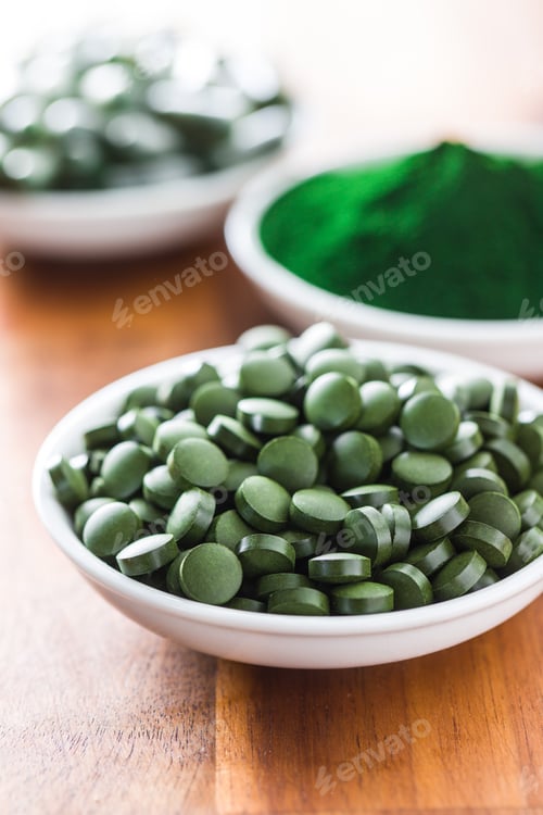 Preview: Green chlorella pills or green barley pills.