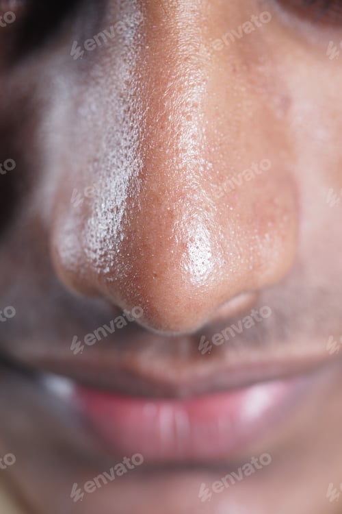 Preview: Close-up view of a man's nose and lips during daytime