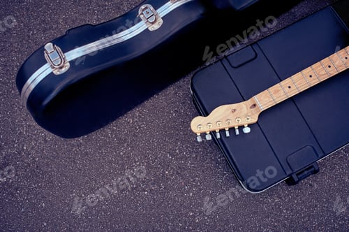 Preview: top view of musical instruments in cases lying on street