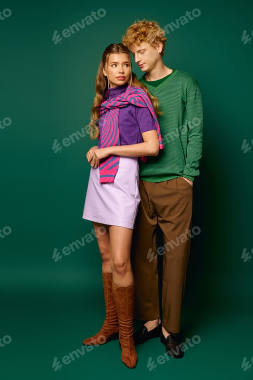 Preview: Vibrant young couple showcasing stylish fashion and romantic connection in a modern setting