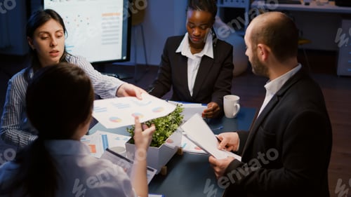 Preview: Diverse multi ethnic businesspeople sharing management presentation on paperwork