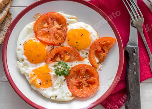 Preview: eggs with tomatoes served, topview