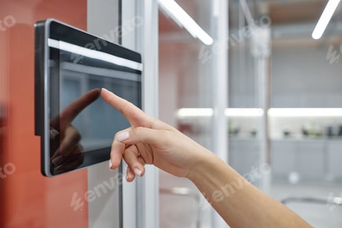 Preview: Hand of Woman Using Touch Screen Entering Access Code to Unlock Office Room Indoors