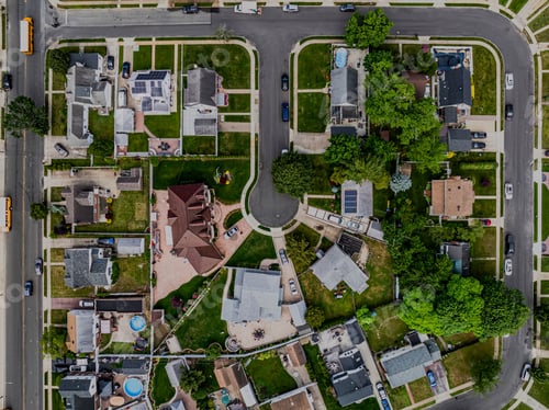 Preview: Top-down view over a middle-class residential neighborhood on a cloudy day.