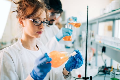 Preview: Young students of chemistry working in laboratory