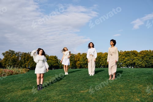 Preview: Stylish women embracing springtime confidence in a vibrant outdoor park