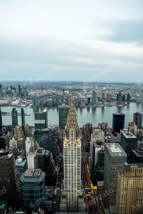 Preview: Scenic cityscape with modern skyscrapers and Chrysler Building at riverside