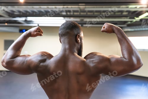 Preview: Black bodybuilder showing his body shirtless