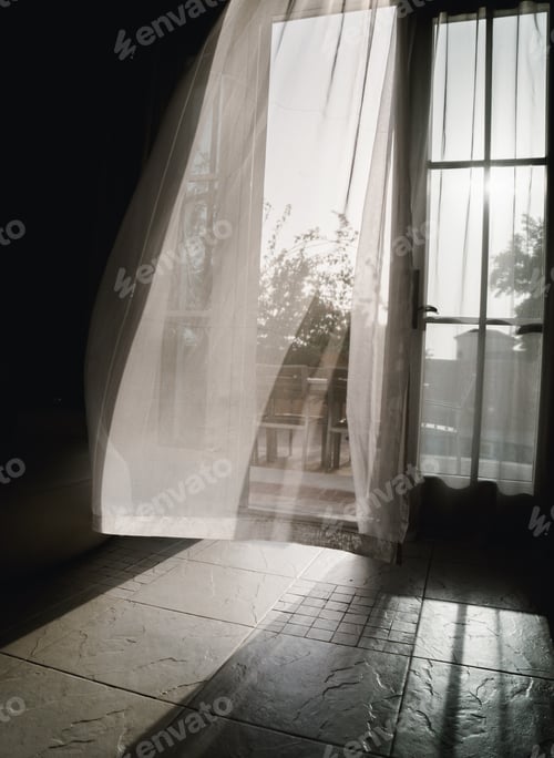 Preview: Airy curtain blowing on the wind in the doorway