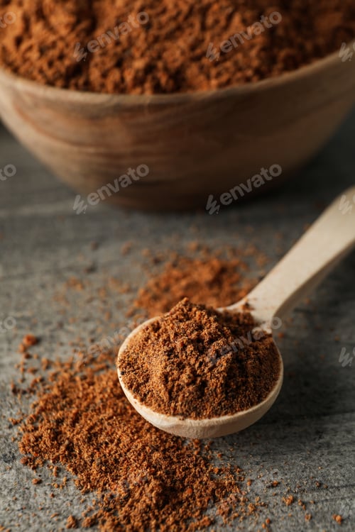 Preview: Concept of spices and condiments, nutmeg powder, close up