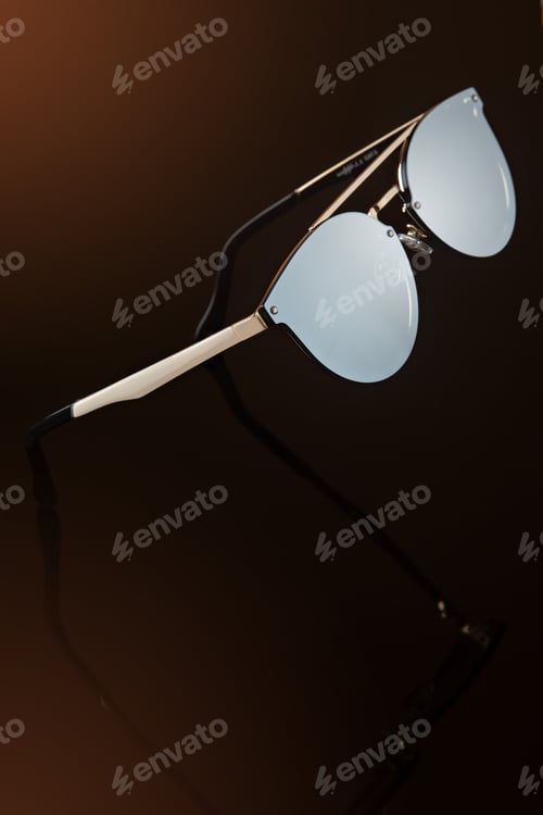 Preview: levitating sunglasses on brown background