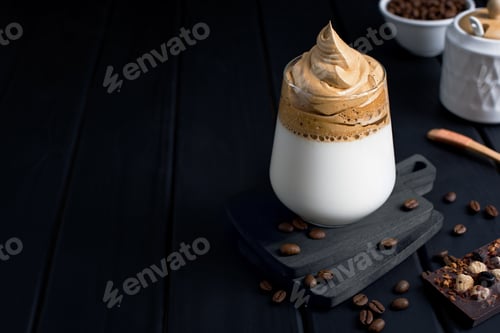 Preview: Dalgona coffee on a dark wooden background with copy space.
