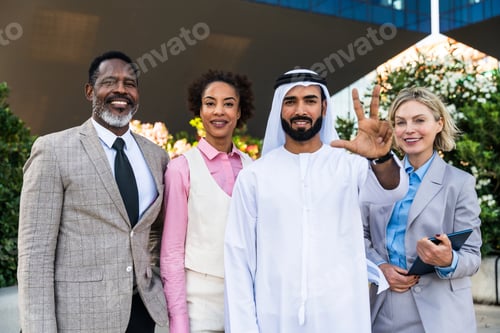 Preview: Group of multiethnic business people meeting an emirati businessman