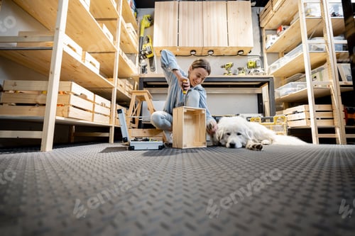 Preview: Woman reparing with a dog in the workshop