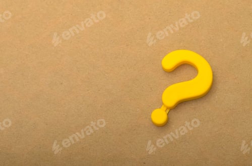 Preview: Bright Yellow Question Mark on a Tan Background