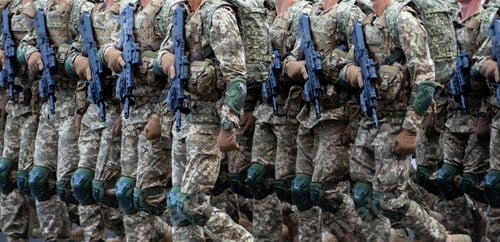 Preview: Military soldiers march in a parade with weapons. Pixel uniform. Soldier's legs. Military background