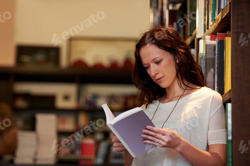Preview: A young woman lost in the pages of a novel against a backdrop of full bookshelves