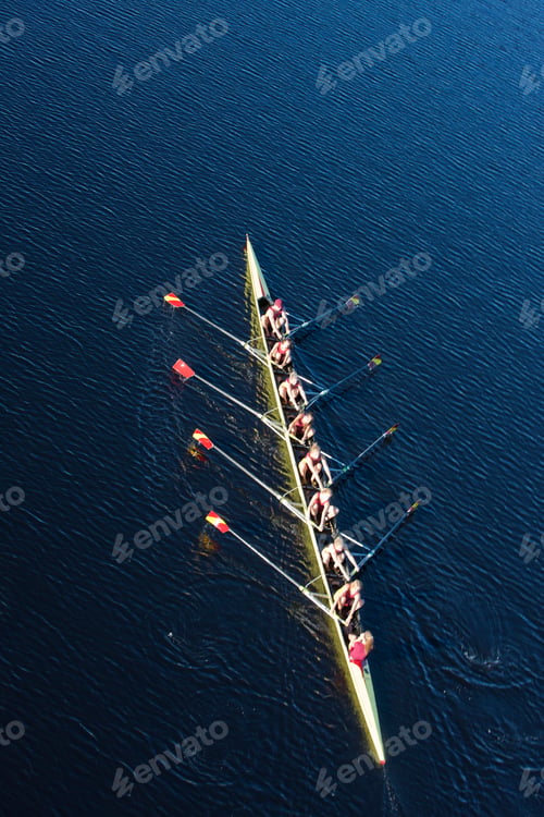 Preview: Elevated view of female's rowing eight in water