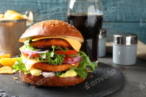 Preview: Slate plate with double vegetarian burger on table