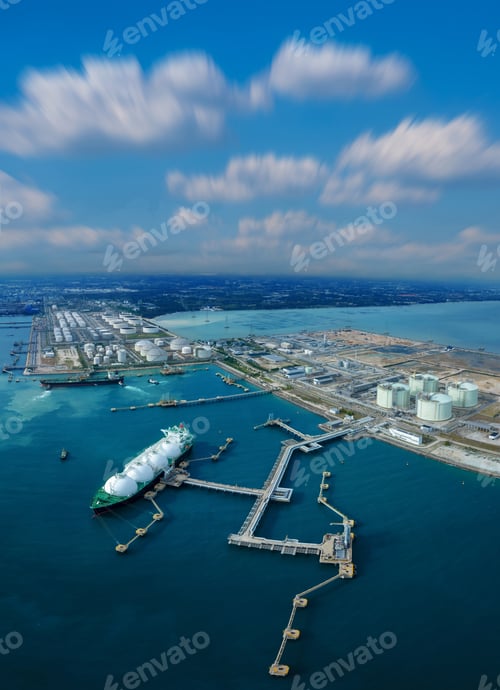 Preview: LNG (Liquified Natural Gas) tanker anchored in Gas terminal gas tanks for storage. Oil Crude Gas