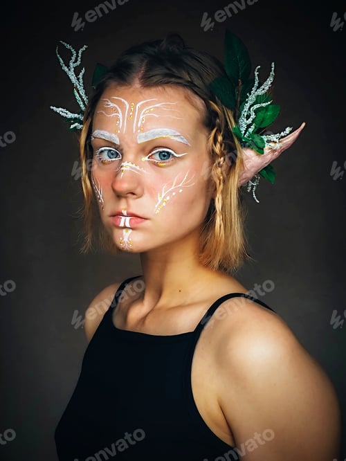 Preview: Blonde girl in a fantasy image of a forest elf for a Halloween party