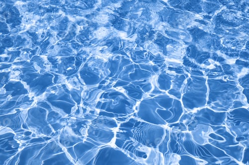 Preview: Abstract water background with ripples. Light caustics effect.