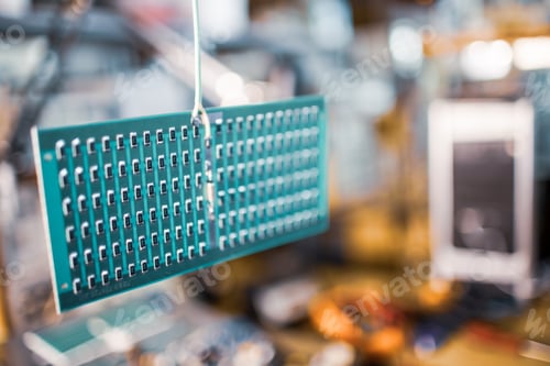 Preview: Close-up side view of a panel of SMD resistors