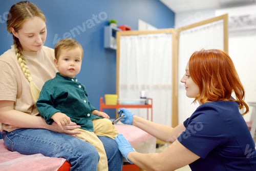 Preview: Baby and his mother are being seen by a pediatric neurologist in a modern medical clinic.