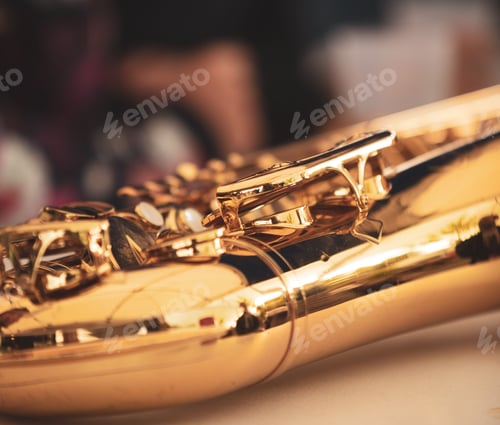 Preview: Closeup shot of details on a shiny brass saxophone
